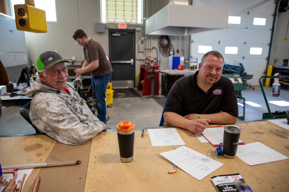 South Dakota CTE advisor working with SkillsUSA student members at a chapter activity